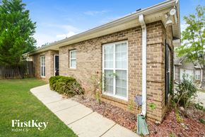 Bessemer house for rent - a brick house with a yard and a sidewalk
