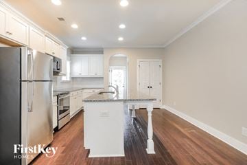 Bessemer house for rent - a kitchen with a counter top and a refrigerator