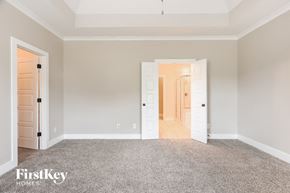 Bessemer house for rent - a master bedroom with a carpeted floor and white doors