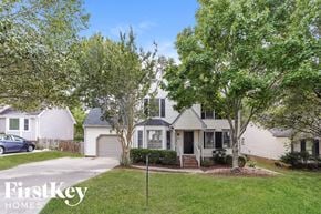 Greensboro house for rent - a white house with trees in front of it