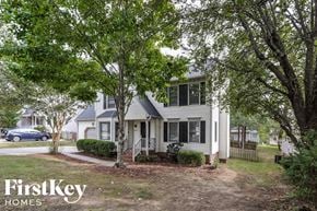 Greensboro house for rent - a white house with trees in front of it