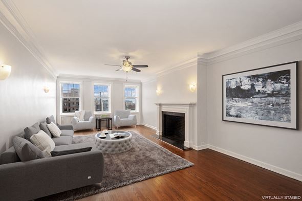 Chicago apartment for rent - a living room with a couch and a fire place