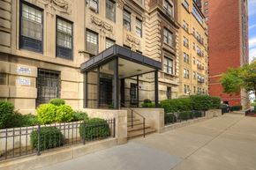 Chicago apartment for rent - a building with stairs and a sidewalk in front of it