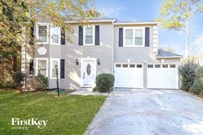 Acworth house for rent - a white house with a white garage door and a lawn