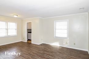 Memphis house for rent - a living room with a hard wood floor and white walls