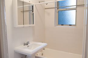 Chicago apartment for rent - a bathroom with a sink and a tub and a window