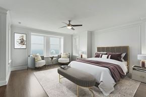 Chicago apartment for rent - a bedroom with a bed and a ceiling fan