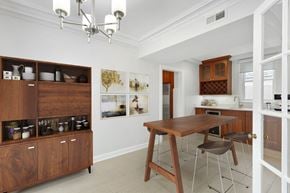 Chicago apartment for rent - a dining room with a wooden table and chairs