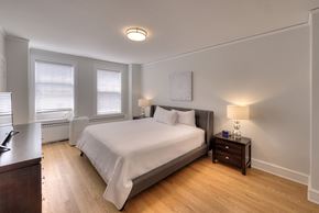 Chicago apartment for rent - a bedroom with a bed and two windows