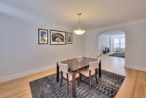 Chicago apartment for rent - a dining room with a wooden table and chairs