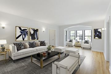 Chicago apartment for rent - the living room has a hardwood floor and white couches