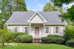 Winston-Salem house for rent - a white house with a gray roof and a porch