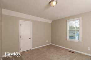 Winston-Salem house for rent - a bedroom with a white door and a window
