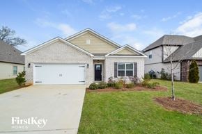 Moody house for rent - a white brick house with a white garage door