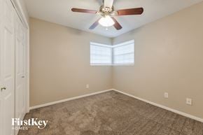 Spring house for rent - the master bedroom has a ceiling fan and carpeted flooring