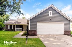 Indianapolis house for rent - A house with a garage door is for sale by FirstKey Homes.