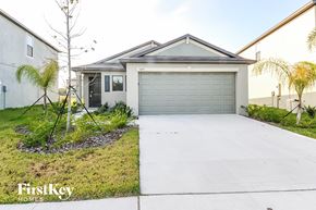 Wimauma house for rent - A house with a garage and a driveway is for sale.