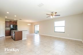 Wimauma house for rent - A spacious kitchen with a dining area and a ceiling fan.