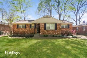 Memphis house for rent - A brick house with a green lawn in front.