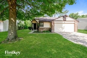 Indianapolis house for rent - A house with a tree in front of it.
