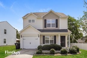 Winston-Salem house for rent - a white house with a black roof and a driveway
