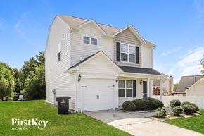 Winston-Salem house for rent - a white house with a garage and a driveway