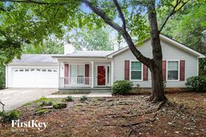 Flowery Branch house for rent - a small white house with a tree in the front