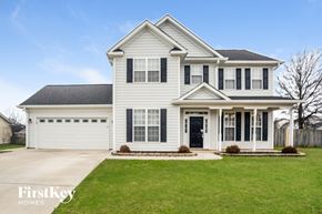 Concord house for rent - a white house with black shutters and a lawn