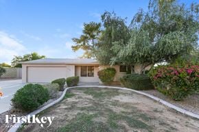 Tempe house for rent - A house with a garden in front of it.