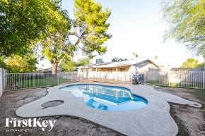 Tempe house for rent - A Firstkey Home pool surrounded by a white fence.