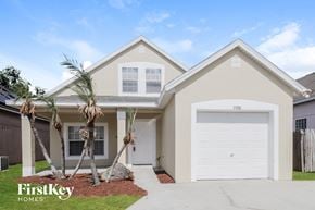 Orlando house for rent - A two-story house with a garage and a driveway in front.