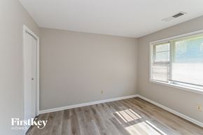 Memphis house for rent - the living room of a home with wood flooring and a window