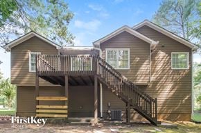 Dallas house for rent - the exterior of a house with a deck and a staircase