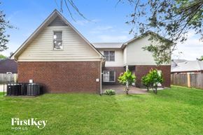 Memphis house for rent - A house with a white and beige exterior is for sale.