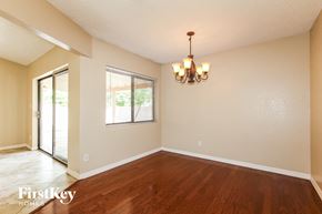 Glendale house for rent - a dining room with hardwood floors and a window and a chandelier