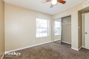 Glendale house for rent - a bedroom with a ceiling fan and a door to a closet