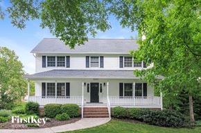 Clemmons house for rent - a white house with black shutters and a lawn and trees