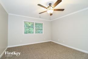 Clemmons house for rent - the master bedroom has a ceiling fan and a carpeted floor