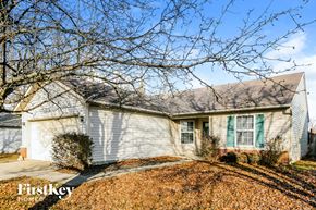 Indianapolis house for rent - A house with a tree in front of it.