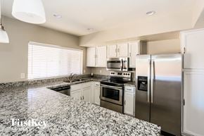 Glendale house for rent - A kitchen with granite countertops and stainless steel appliances.