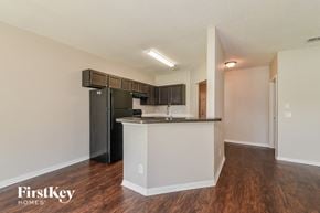 North Port house for rent - a kitchen with a counter top and a refrigerator