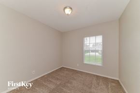 North Port house for rent - the second bedroom with carpet and a window