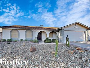 Glendale house for rent - a house with a gravel driveway and a cactus