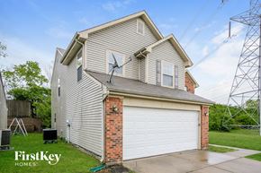 Indianapolis house for rent - a white house with a white garage door