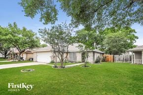 Houston house for rent - A well-maintained lawn with a FirstKey Homes logo.