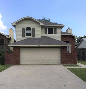 Mesquite house for rent - a white garage door in front of a house
