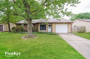 Indianapolis house for rent - A house with a tree in front of it.