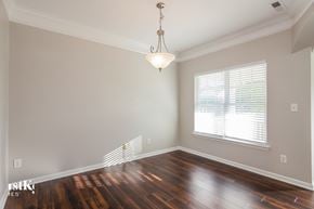 Concord house for rent - an empty living room with wood floors and a large window