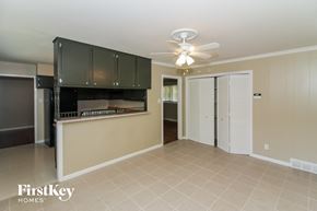 Memphis house for rent - a living room with a kitchen and a ceiling fan