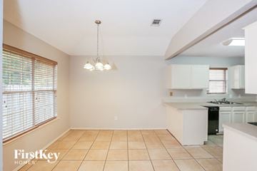 Arlington house for rent - a kitchen with a sink and a large window